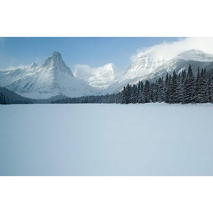 Winter view from Glenns Lake of Pyramid, Cathedral, Kit, and Stoney Indian Peaks in Glacier National Park