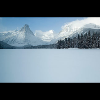 Winter view from Glenns Lake of Mount Kitt, Pyramid, Cathedral, and Stoney Indian Peaks in Glacier National Park