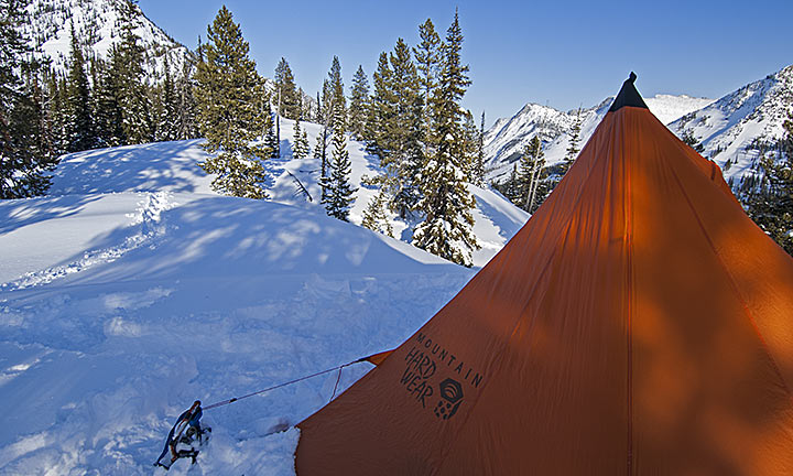 A one-pole, four-man pyramid tent in a winter setting
